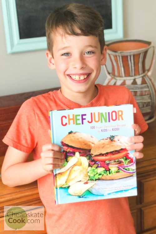 kid with Chef Junior cookbook
