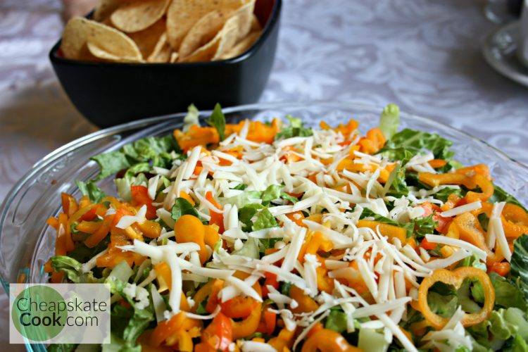 Cheesy, frugal, delicious Nacho Dip made with real food and only 50 cents per serving. Dairy-free, Vegetarian, and Vegan versions too! From CheapskateCook.com