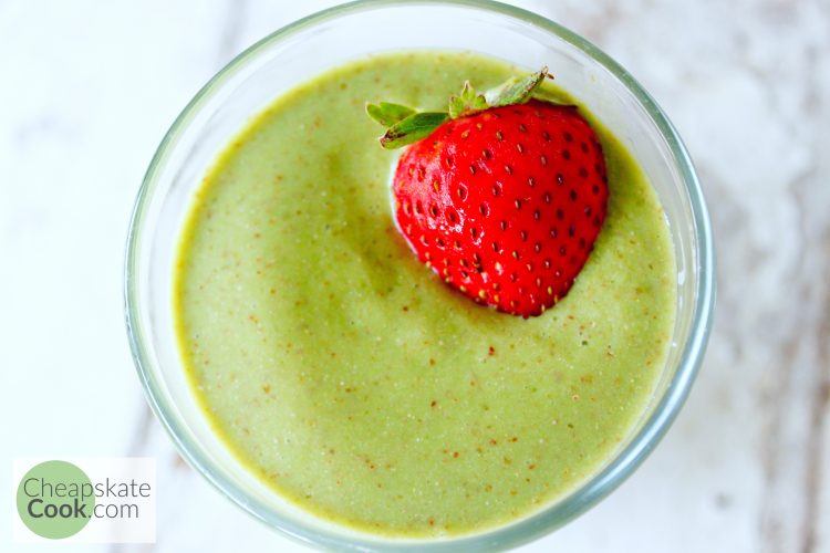 green smoothie with a strawberry