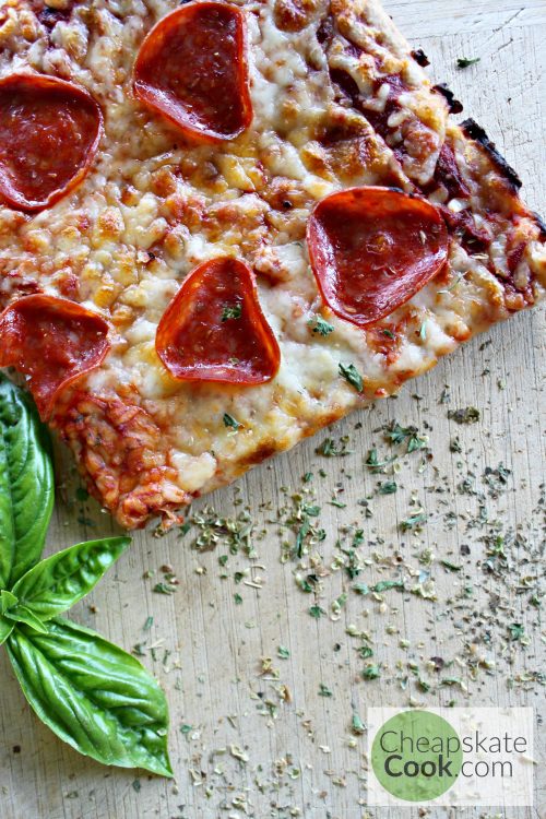 Easy, delicious, garlicky pizza crust that you can make with white flour or whole grain. Costs about 70 cents per pizza. So now we can eat more pizza!