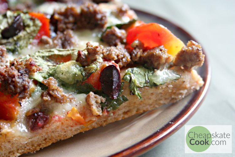 Easy, delicious, garlicky pizza crust that you can make with white flour or whole grain. Costs about 70 cents per pizza. So now we can eat more pizza!