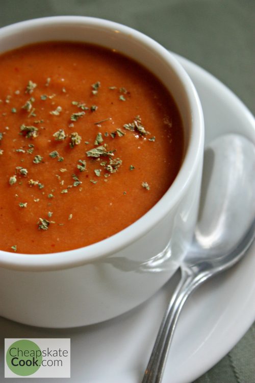 Frugal Holiday Dish - Simple, inexpensive tomato soup ready in 10 minutes and full of real food ingredients you can find at any store. Dairy-free version too! From CheapskateCook.com