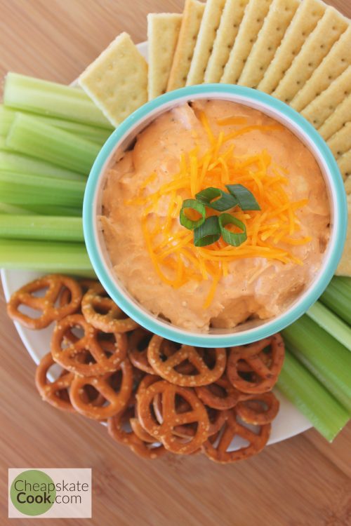 Buffalo Chicken Dip with celery, crackers, and pretzels for your Super Bowl Party