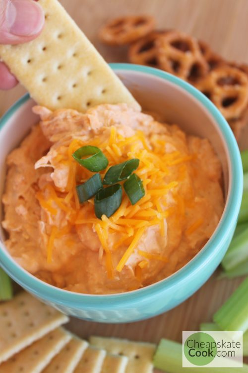 Cracker dipped in Buffalo Chicken Dip for your Super Bowl Party