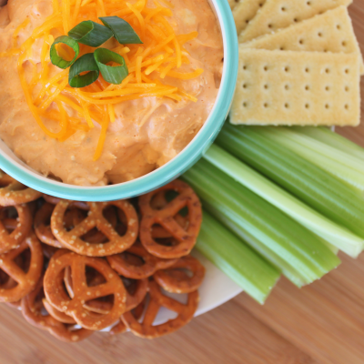 With an eye towards real food, saving money, and making something delicious for a party, this frugal Buffalo Chicken Dip is perfect for a relaxed dinner party, the Super Bowl, or comfort food for a weekend at home. Gluten-free and Paleo too! From CheapskateCook.com