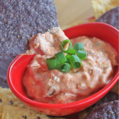 2-Ingredient Creamy Salsa Dip - Possibly the easiest crowd-pleasing real food dip. No fuss, no measurements, and sure to please the pickiest eaters. Perfect for game day or the next family gathering! Gluten-free too! From CheapskateCook.com.