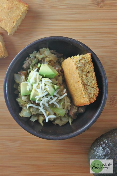 Cumin beans & cornbread topped with sautéed cabbage