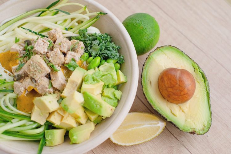 bowl of zoodles with chicken and avocado