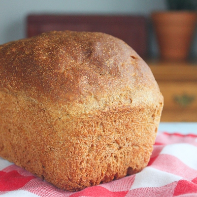 bread with a red and white checked napkin