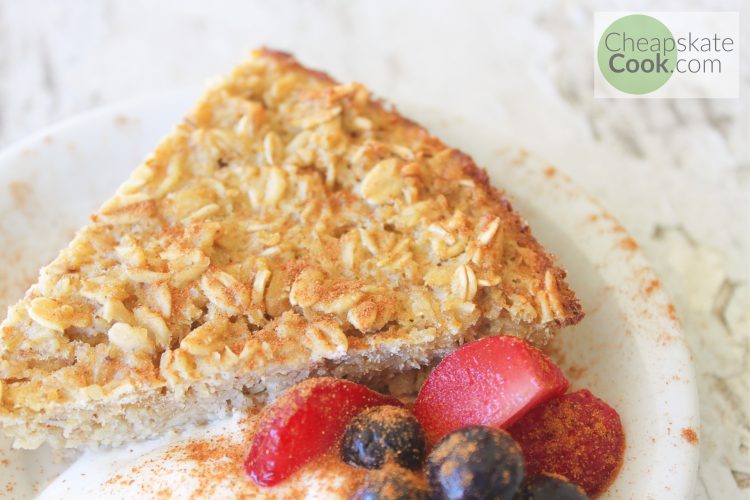 baked oatmeal on a plate with berries