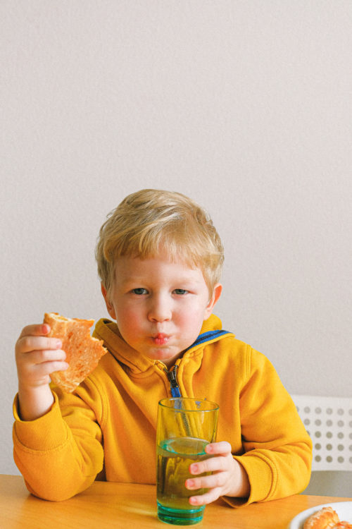 boy eating pizza