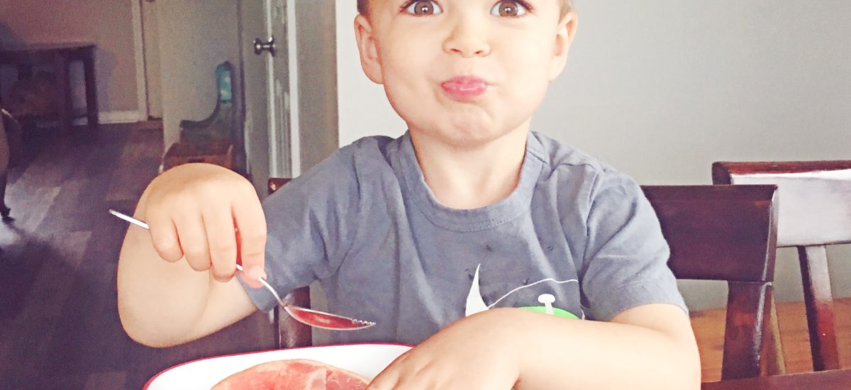 kid eating grapefruit