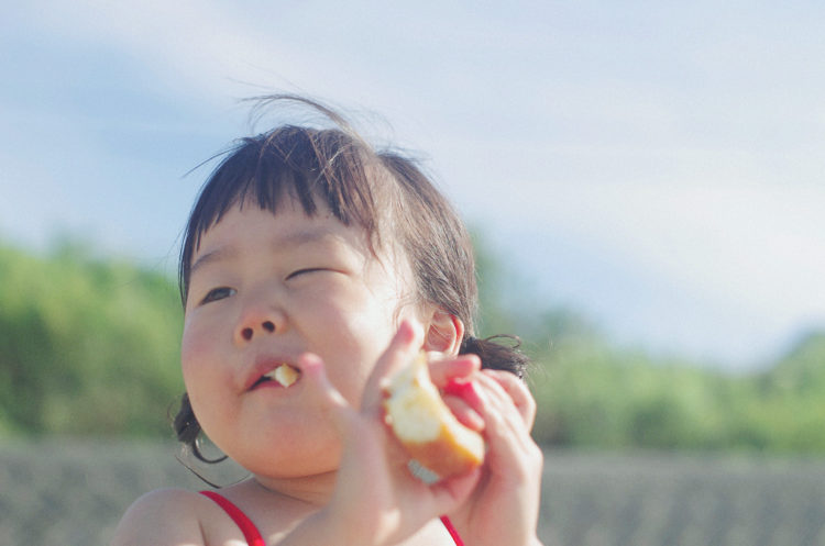 girl eating bread