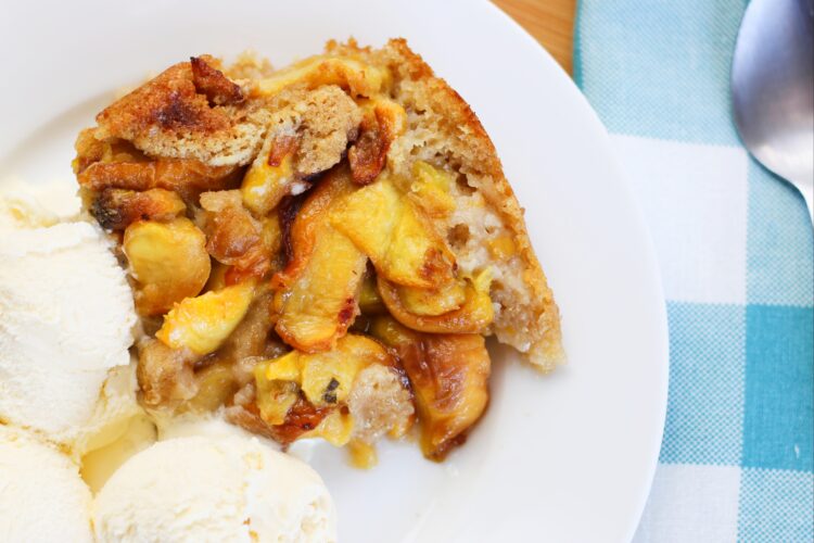 peach cobbler with ice cream on a plate
